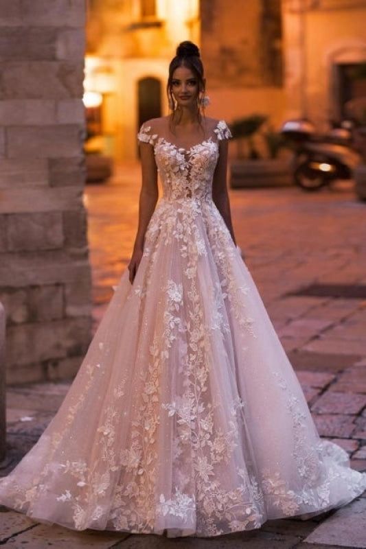 a woman in a wedding dress standing on the street