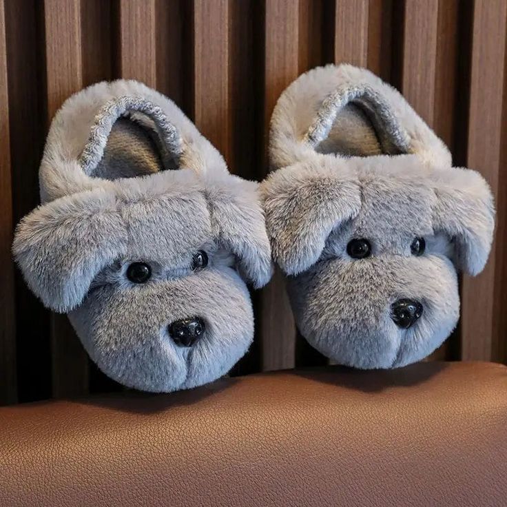 Keep your little ones cozy and stylish with our Winter Warm Cartoon Dog Kids Slippers. These adorable indoor slippers are designed for both boys and girls, offering warmth and comfort for all occasions. Our slippers feature a playful animal print design on the sole, adding a touch of fun to your child's everyday wear. The cute dog cartoon adds character and charm to their indoor footwear. These slippers are designed with a non-slip sole, ensuring your child's safety as they move around the house Cute Winter Slippers With Plush Lining, Cute Winter Slippers With Soft Sole, Playful Winter Slip-on Slippers, Comfortable Plush Winter Slippers, Comfortable Plush Slippers For Winter, Comfortable Plush Slippers With Round Toe, Non-slip Cartoon Slippers With Round Toe, Cartoon Style Non-slip Slippers With Round Toe, Cartoon Style Non-slip Round Toe Slippers