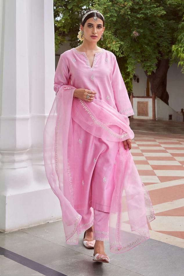 Light pink straight suit with floral resham, dori embroidery and side slits. Paired with palazzo and dupatta.
Components: 3
Pattern: Embroidered
Type Of Work: Floral
Neckline: Notched
Sleeve Type: Three quarter
Fabric: Chanderi silk
Color: Pink
Other Details: 
Side slits
Length:
Kurta: 46 inches
Palazzo: 36 inches
Occasion: Puja - Aza Fashions Pink Suits Women, Suit Palazzo, Suit Neck Designs, Function Dresses, Diwali Outfits, Traditional Attires, Embroidered Suit, Light Pink Dress, Palazzo Set