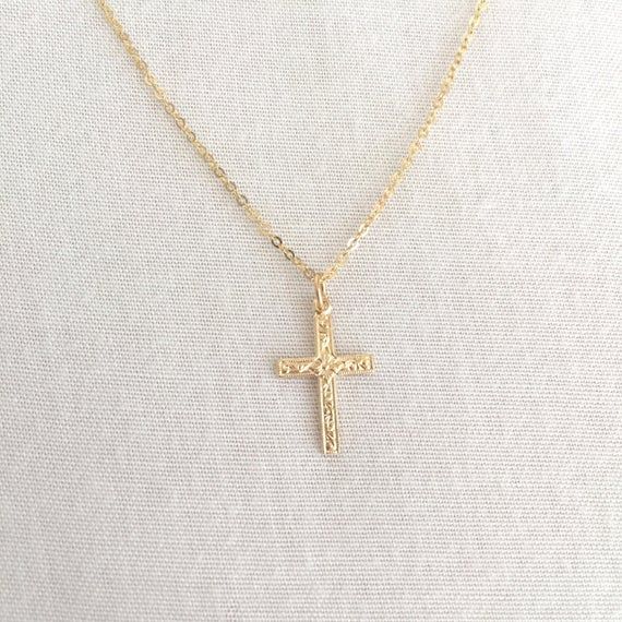 Simple Gold Filled Cross Necklace, First Communion Necklace, Baby Baptism Necklace, Confirmation Necklace, Everyday Necklace, Mom NecklaceAvailable in 14K Gold Filled ONLY.Specification. All component is 14K Gold Filled NOT plated. Cross size 10.2 x 16.4mm. Comes in a satin pouch. Length includes jump ring and claspIMPORTANT:Usually jewellery in the pictures looks bigger than in reality.Please consider all given dimension and compare them to the ruler before ordering.More collections of Religiou Yellow Gold Cross Necklaces For Baptism, Gold Cross Pendant Necklace For Baptism, Gold Cross Jewelry For Baptism, Dainty Cross Necklace For Baptism, Spiritual Cross Pendant Necklace For First Communion, Adjustable Crucifix Necklace For Gift, Gold Cross Pendant Necklace For First Communion, Dainty Adjustable Jewelry For Baptism, Gold Cross Pendant Jewelry For Baptism