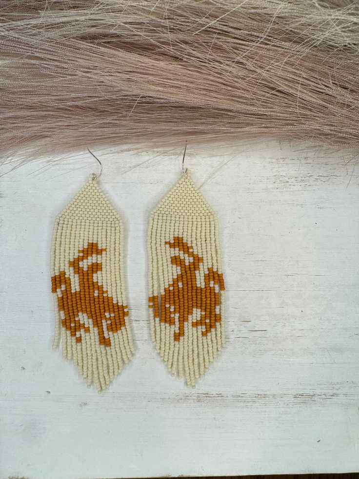 Hand beaded glass bead earrings. Hypoallergenic Hooks Cowboy Beaded Earrings, Handmade Cream Beaded Earrings With Round Beads, Handmade Cream Beaded Earrings, Cream Beaded Round Earrings, Handmade Cream Beaded Drop Earrings, Handmade Cream Beaded Earrings Gift, Cream Beaded Dangle Earrings, Cream Beaded Dangle Jewelry, Adjustable Cream Beaded Earrings