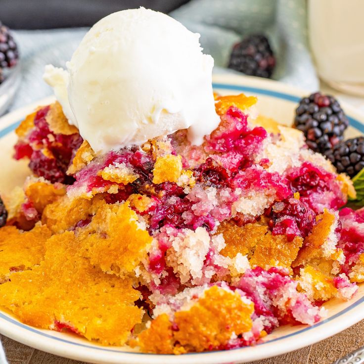 a plate topped with fruit cobbler and ice cream