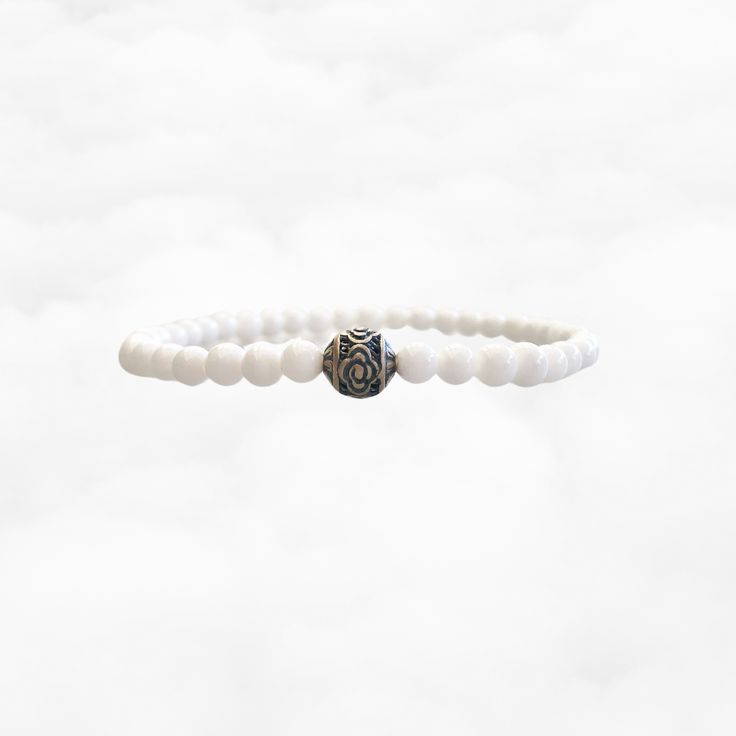 Auspicious clouds symbolize the link between humanity and the divine, embodying spiritual connection and protection. This bracelet features sterling silver auspicious clouds paired with natural tridacna beads, capturing both elegance and spiritual significance. ⚜Item Specifics ❀ Sterling Silver Auspicious Clouds (8mm)❀ Genuine Natural Tridacna Beads (4mm)❀ Length: 16cm White Beaded Bracelets With 108 Beads For Meditation, Spiritual White Gemstone Beads Stretch Bracelet, White Spiritual Stretch Bracelet With Gemstone Beads, Spiritual Sterling Silver Beaded Bracelet For Meditation, Sterling Silver Beaded Bracelets For Meditation, Adjustable White Pearl Bracelet In Sterling Silver, Adjustable White Sterling Silver Pearl Bracelet, Spiritual Beaded Pearl Bracelet, Symbolic White Jewelry With Round Beads