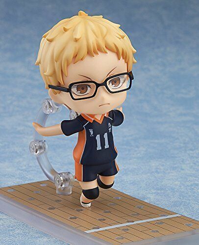 a figurine with glasses on top of a board