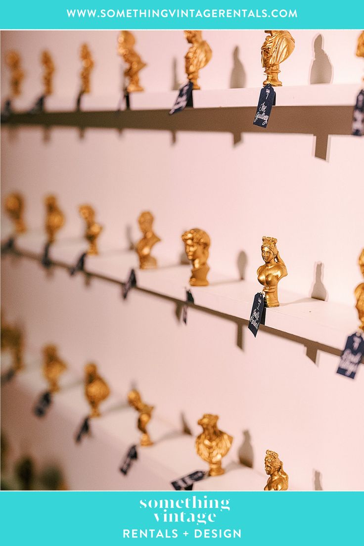 several rows of small gold figurines on shelves