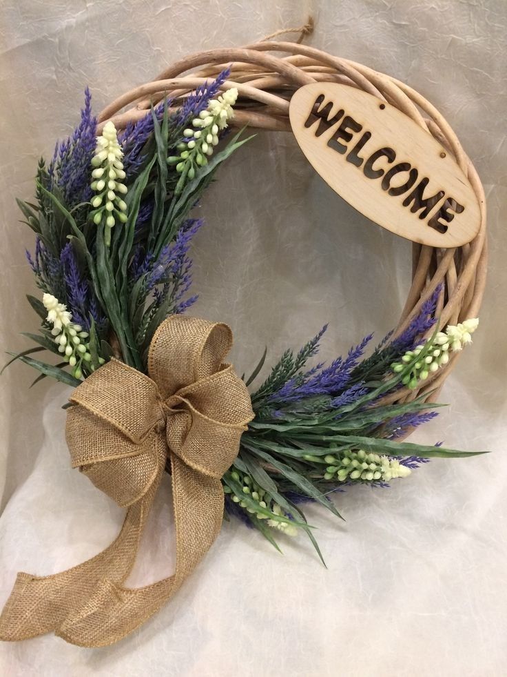 a wreath with a welcome sign on it