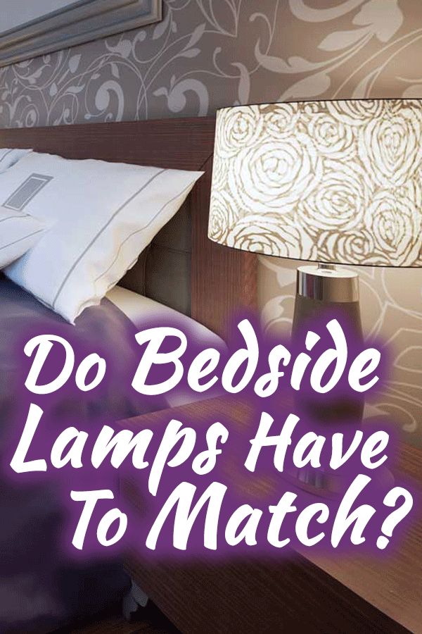 a bed sitting next to a night stand with a lamp on it and the words do bedside lamps have to match?