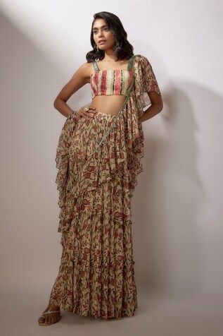 Beige printed pre-draped saree in georgette fabric. Paired with a printed blouse in crepe base with sequin work. - Aza Fashions Summer Traditional Pre-draped Saree With Printed Motifs, Multicolor Bohemian Fitted Pre-draped Saree, Bohemian Multicolor Fitted Pre-draped Saree, Fitted Floral Print Draped Set, Bohemian Style Multicolor Fitted Pre-draped Saree, Fitted Pre-draped Saree With Printed Motifs For Reception, Floral Print Draped Dress For Festive Occasions, Festive Draped Floral Print Dress, Fitted Floral Print Dress With Traditional Drape