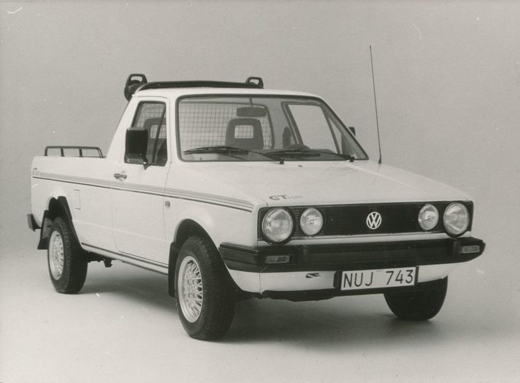 a black and white photo of a volkswagen truck