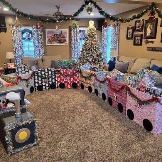 a living room decorated for christmas with presents