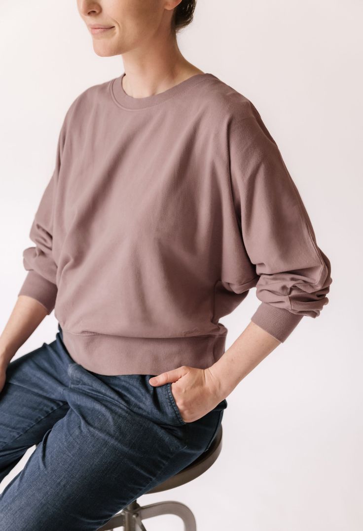 Our newest Womens Sweatshirt is a must-have for moms on the go! Made from 100% organic French Terry cotton, a soft plush texture you'll recognize from your comfiest loungewear, each piece of this collection is garment dyed for a vintage washed look and has the softest hand-feel. With wide, dolman-style sleeves and a relaxed fit, you will be comfortable on the move or taking much needed moments of relaxation. The ribbed trim at the neckline and cuffs adds the perfect finishing touch. Better yet, Veggie Patch, Organic Baby Clothes, Much Needed, Soft Hands, Bottom Clothes, Rain Wear, Soft Plush, French Terry, A R