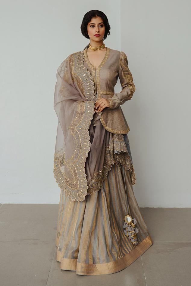 Smoky grey tissue woven lehenga with dori and resham hand embroidery. Comes with a blouse and a dupatta.
Components: 3
Pattern: Hand embroidered
Type Of Work: Dori, Resham
Neckline: Leaf Neck
Sleeve Type: Full
Fabric: Tissue
Color: Grey
Other Details: 
Note : Outfit worn by the model on the right is not for sale.
Occasion: Sangeet - Aza Fashions Paplam Style Blouse For Women, Lakme Fashion Week 2024, Tissue Dresses, Sangeet Outfits For Women, Nepal Wedding, Lehenga Pattern, Sangeet Outfit, Kameez Designs, Lehnga Dress