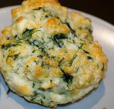 a close up of a plate of food with broccoli and cheese on it