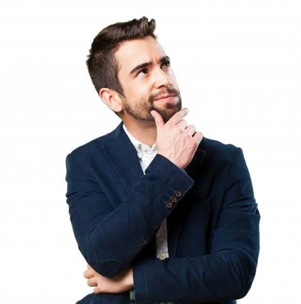 a man in a suit is posing for the camera with his hands on his chin