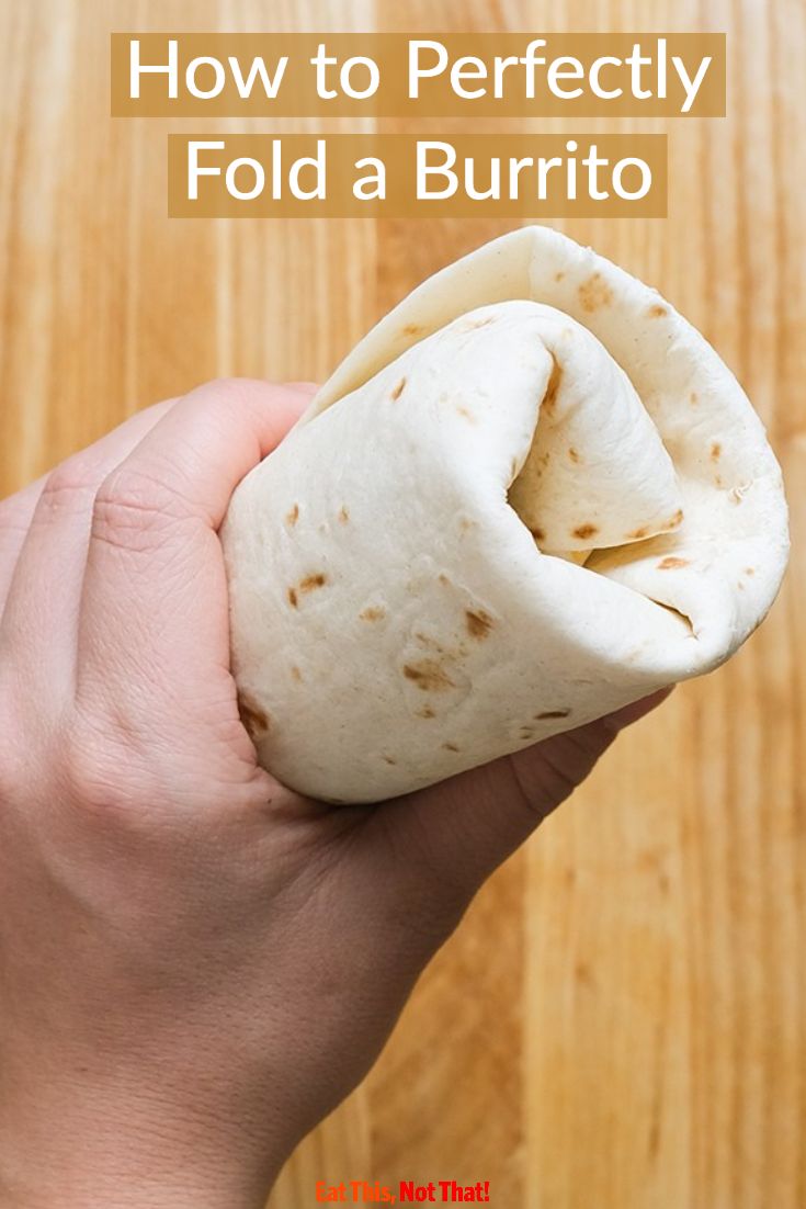 someone holding a burrito in their hand with the text how to perfectly fold a burrito