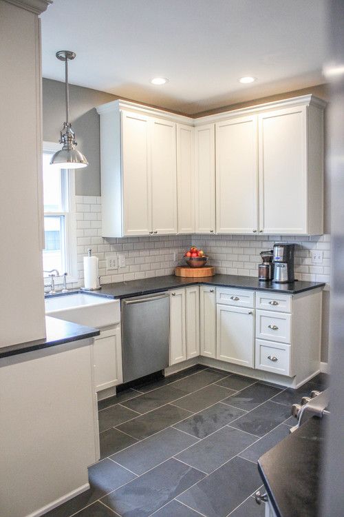 the kitchen is clean and ready for us to use it's new tile flooring