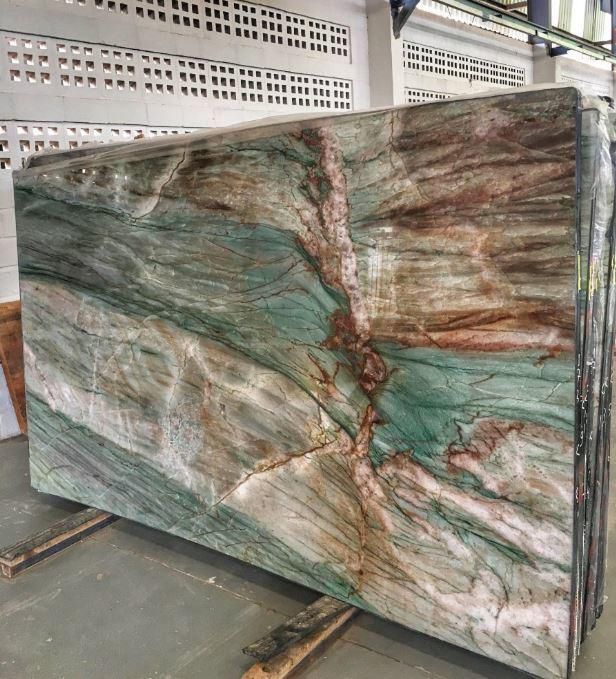 a large marble slab sitting on top of a wooden pallet in a warehouse area