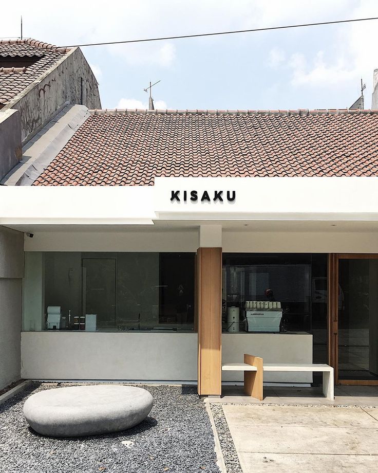 a white building with a sign that says kisaku