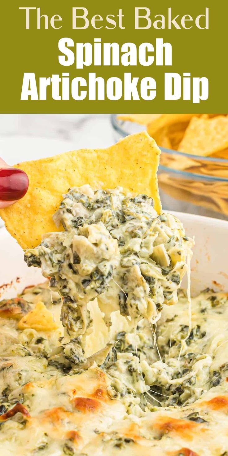 spinach artichoke dip being lifted from a casserole dish with tortilla chips