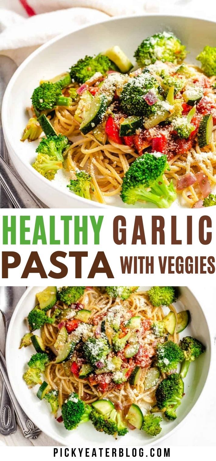 two plates of pasta with vegetables and parmesan cheese on top, one plate has broccoli