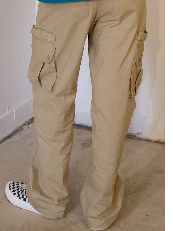 This is a trendy and comfortable pants by ersco that is made out of high quality and sturdy material. With casual mood of the design and unique look, it will give a trendy touch to your comfortable daily outfit.- Casual and unique mood- Side cargo pockets detail- Ripstop fabric with high durability- Engraved snap button on back pocket Beige Cotton Parachute Pants For Outdoor, Urban Beige Pants With Pockets, Urban Style Beige Cargo Bottoms, Urban Beige Cargo Bottoms, Beige Urban Cargo Bottoms, Beige Cotton Pants For Outdoor, Urban Beige Cotton Pants, Trendy Beige Cargo Pants With Cargo Pockets, Trendy Beige Cargo Pants With Multiple Pockets