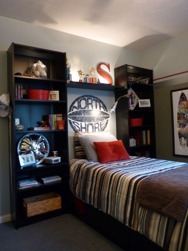 a bed room with a neatly made bed and bookcases