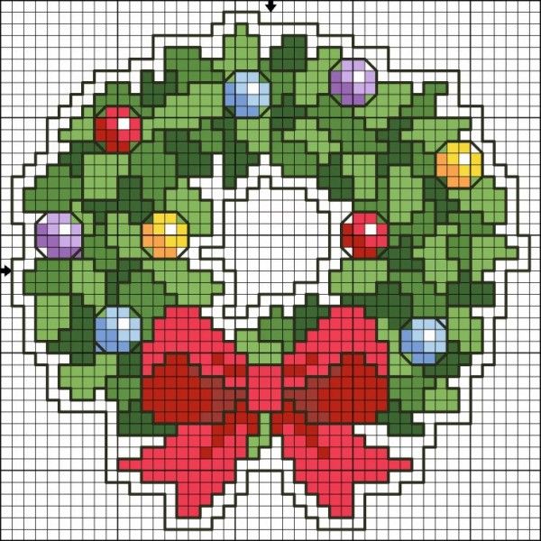 a cross stitch christmas wreath with red bow