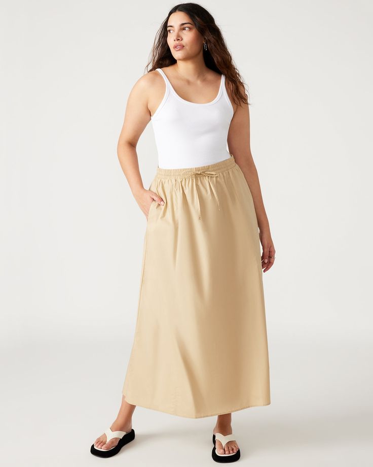 The SUNNY skirt features a comfortable elastic waistband, front tie, and convenient side pockets. This maxi length A-line skirt is perfect for both casual outings and dressier occasions. A-line maxi skirt Elastic waistband with front tie Two functional side pockets Length: 37.25" 100% cotton Hand wash Shop the set here Maelyn is 5ft 11.5in and is wearing a size small Stephanie is 5ft 10in and is wearing a size large Imported Spring Relaxed Maxi Skirt With Gathered Waist, Casual Summer Maxi Skirt With Gathered Waist, Relaxed Maxi Skirt With Elastic Waistband For Vacation, Vacation Maxi Skirt With Elastic Waistband, Vacation Skirt With Gathered Waist In Relaxed Fit, Casual Flowy Maxi Skirt With Gathered Waist, Relaxed Skirt With Gathered Waist For Vacation, Casual Flowy Maxi Skirt With Elastic Waistband, Vacation Skirt With Gathered Waist And Relaxed Fit