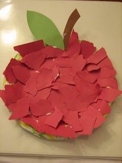 an apple made out of red paper on top of a white table with the caption pin it