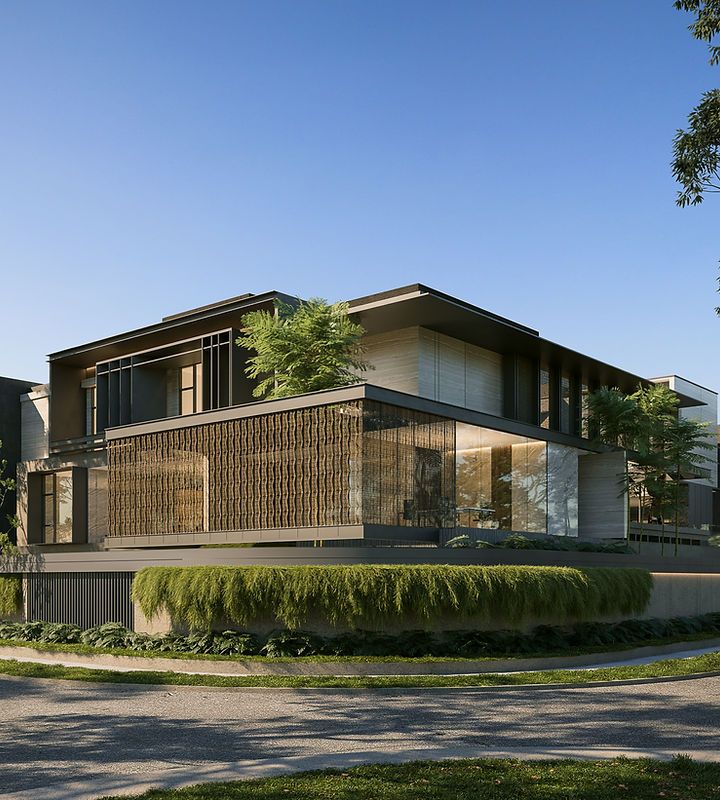 a large modern house on the corner of a street with grass and trees around it