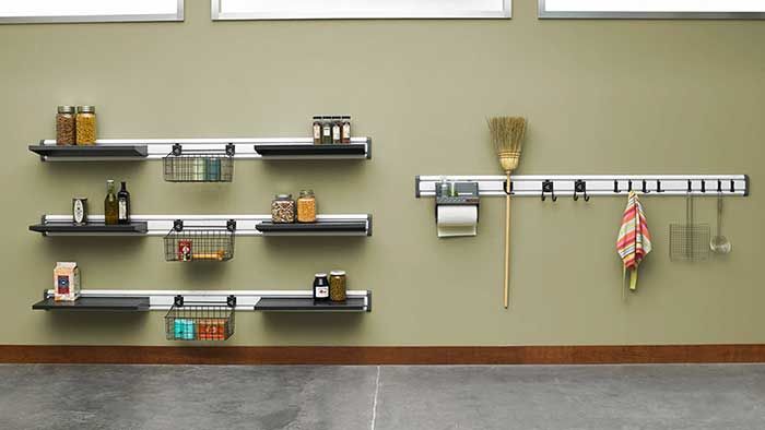 several shelves with various items on them against a wall