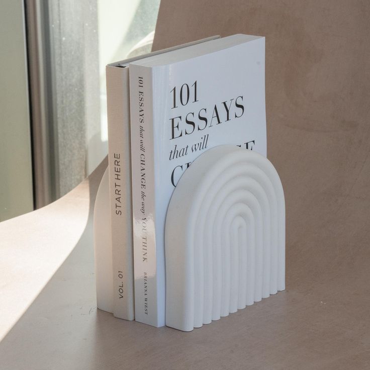 a book sitting on top of a table next to a window