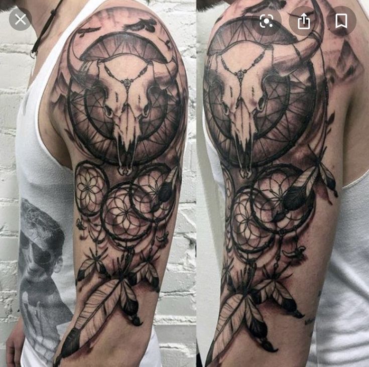 a man with a tattoo on his arm that has an image of a bear and dream catcher