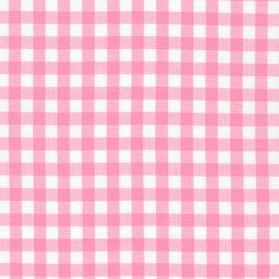 a pink and white checkered table cloth