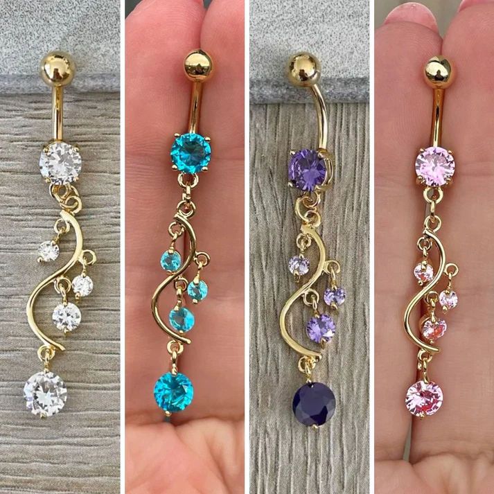 three different types of dangling belly rings