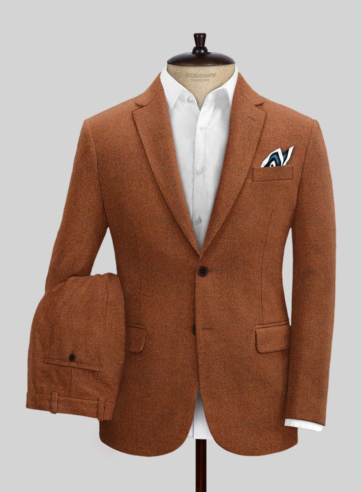 Venture into a stylish era by pulling out Naples Cosmic Tan Tweed Suit, which adds a modern touch to the vintage aesthetics. Further, our suit is cut from a pure wool fabric that showcases a smooth, supple and offers an incredibly sharp drape when worn. Nonetheless, the cloth is cut with expert tailoring, which lets yo Tailored Brown Linen Blazer, Brown Linen Blazer With Welt Pockets, Brown Linen Blazer For Business Casual, Semi-formal Linen Three-piece Suit With Notch Lapel, Orange Tailored Suit With Notch Lapel, Brown Linen Suits For Business Casual, Brown Three-piece Suit With Single Button Notch Lapel, Brown Linen Business Suits, Elegant Tailored Orange Blazer