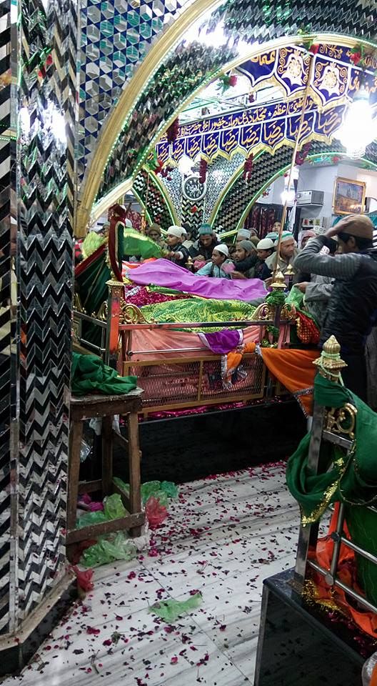 an elaborately decorated room with several beds