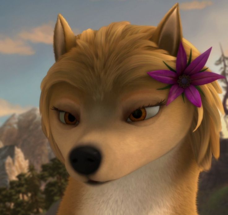 a dog with a purple flower on its head in front of a mountain range and sky