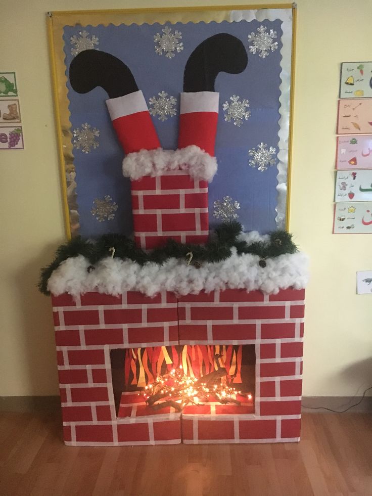 a christmas fireplace with stockings on top and fire in the middle, decorated like santa's chimney