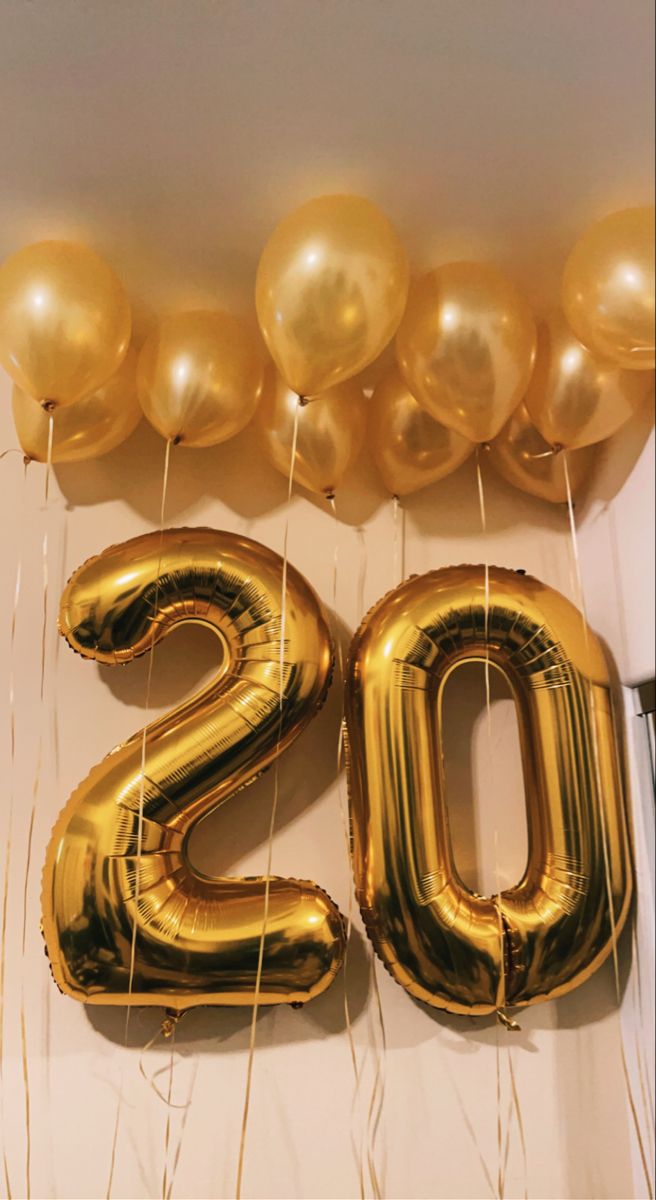 gold balloons and the number twenty two are on display