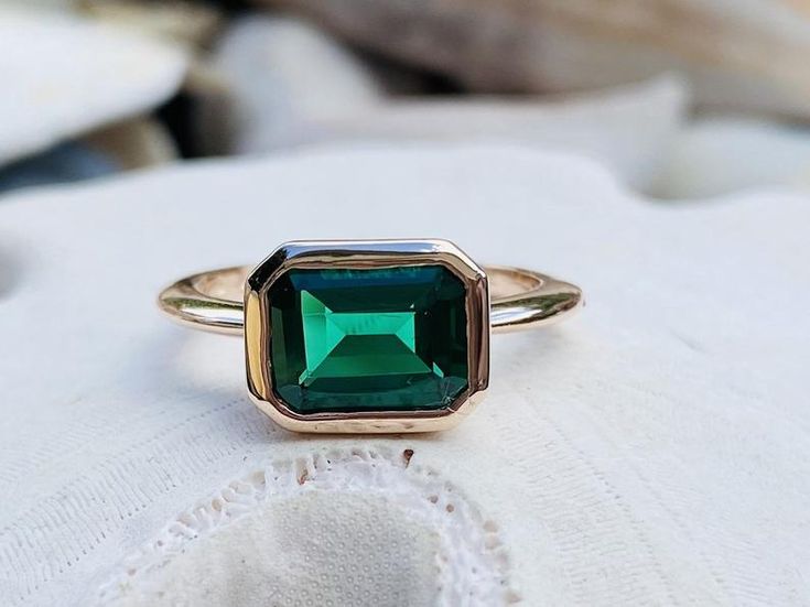 14k Gold Emerald Ring East West Setting Emerald Engagement | Etsy Bezel Set Baguette Cut Emerald Ring, Emerald Ring With Bezel Setting For May Birthstone, Emerald Baguette Cut Ring With Bezel Setting, Baguette Cut Emerald Ring With Bezel Setting, Baguette Cut Bezel Set Emerald Ring, Anniversary Emerald Ring With Bezel Setting, Classic Emerald Ring With Rectangular Bezel Setting, Gift Emerald Ring With Radiant Cut And Bezel Setting, Rectangular Emerald Ring With Bezel Setting As Gift