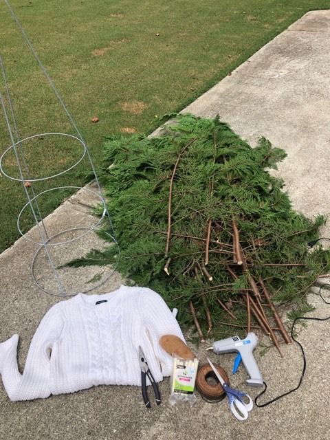 a pile of junk sitting on top of a sidewalk