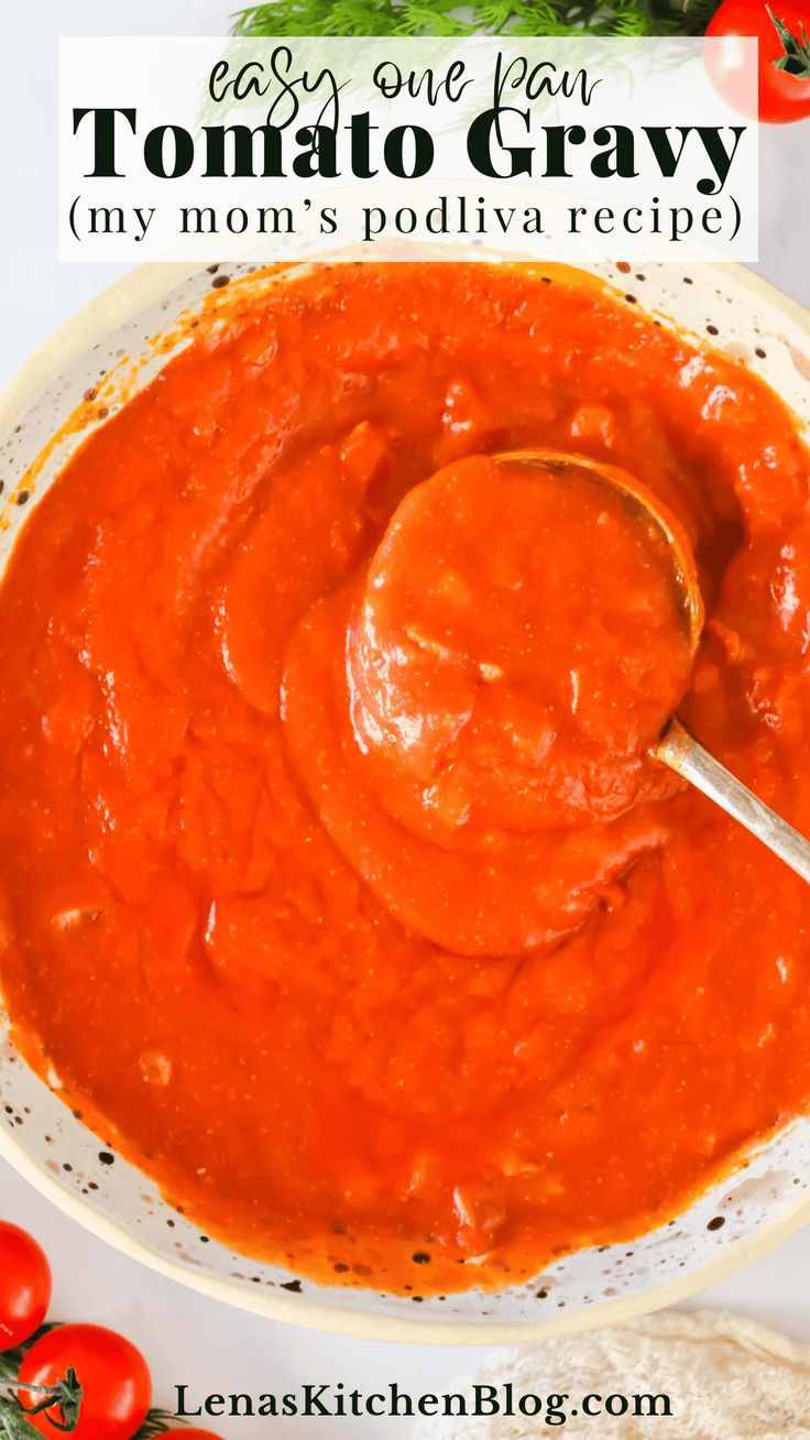 a bowl of tomato sauce with a spoon in it and tomatoes around the bowl on the side