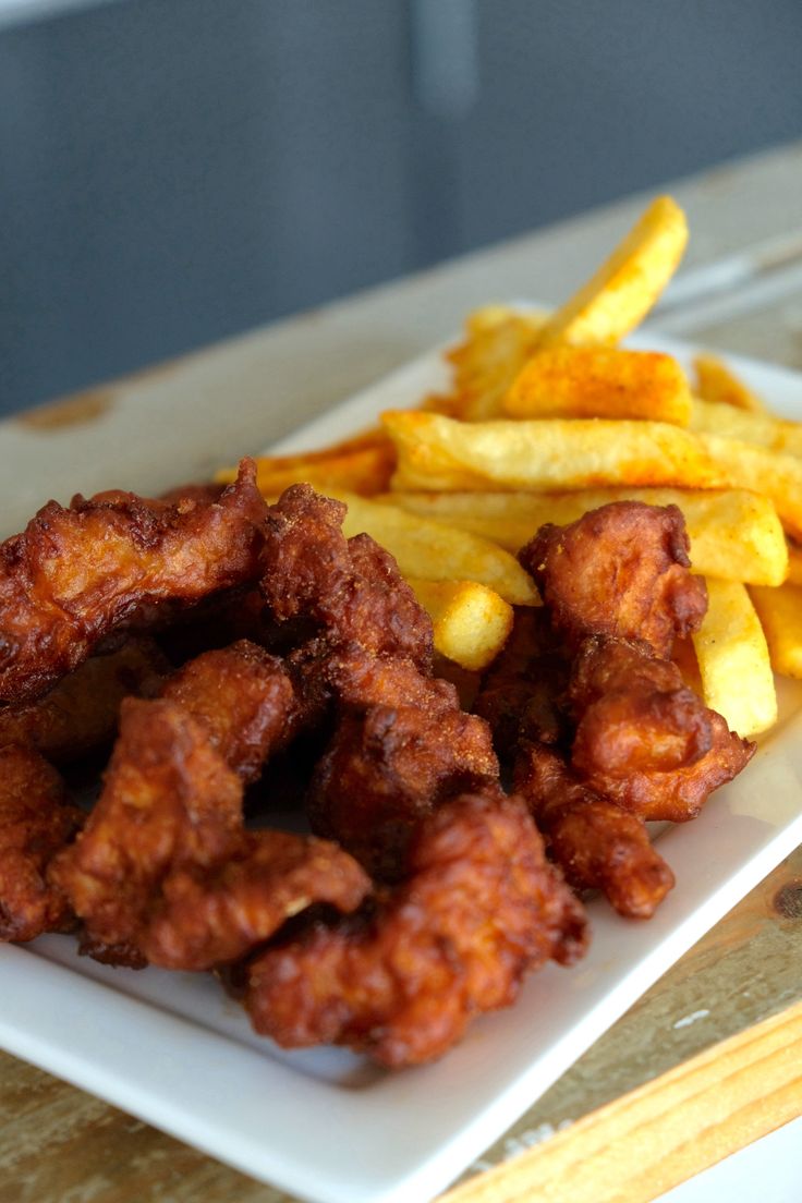 fried chicken and french fries on a white plate