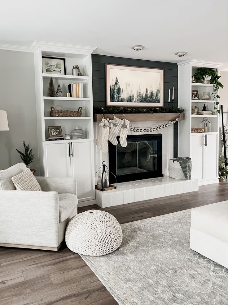 a living room filled with furniture and a fire place in the middle of a room