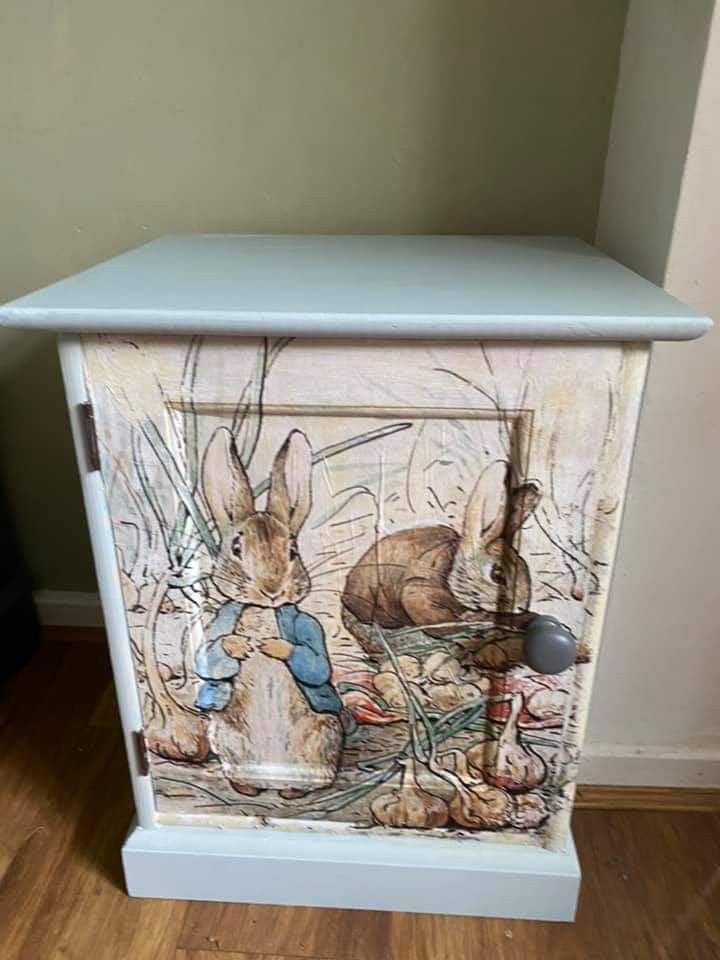 a cabinet with an image of rabbits on it