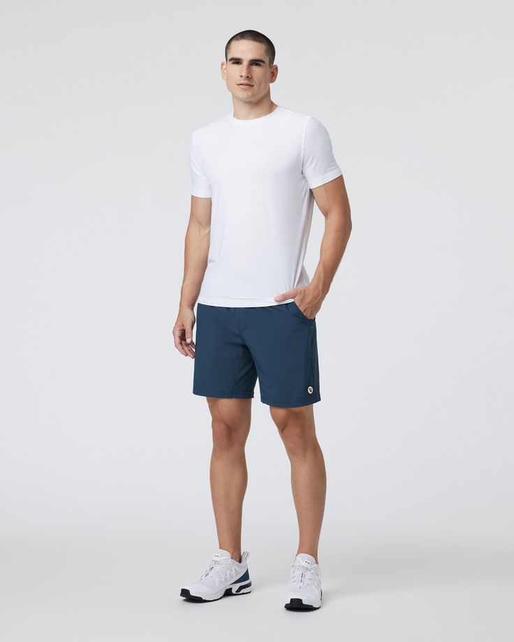 One short for every sport, the Kore Shorts have a classic athletic fit, falling just above the knee with an anywhere and everywhere versatility. Go commando in confidence with the breathable, boxer-brief liner.Also available in 5" and 9" inseam. | Vuori Kore Shorts | Indigo | XXL Vuori makes premium performance apparel inspired by the active Coastal California lifestyle; an integration of fitness, surf, sport, and art. Breaking down the boundaries of traditional activewear, we are a new perspect Blue Cotton Sportswear Shorts, Blue Moisture-wicking Activewear Shorts, Functional Blue Moisture-wicking Shorts, Blue Moisture-wicking Outdoor Shorts, Navy Moisture-wicking Sportswear Shorts, Coastal California, California Lifestyle, Shorts For Men, Athletic Fits