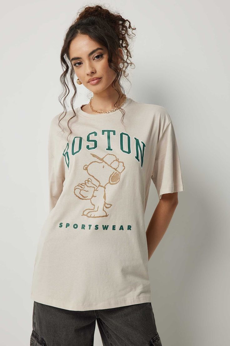 Let your graphic tee do the talking. Crew neck Short sleeves Snoopy print Oversized fit 100% cotton Model is wearing size SOfficial licensed product of Peanuts. | Ardene Oversized Boston Snoopy T-Shirt in Beige | Size Medium | 100% Cotton Snoopy Print, Snoopy Shirt, Snoopy T Shirt, Oversized Fits, Womens Clothing Tops, Graphic Tee, Boston, Shirt Blouses, Top Shirt