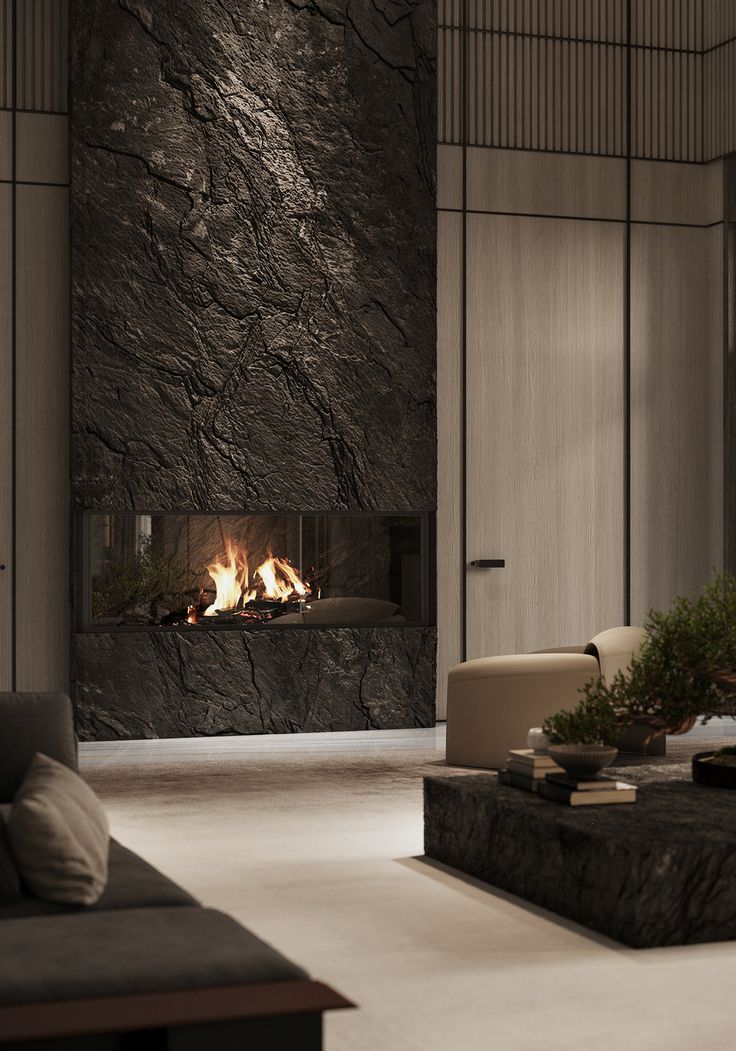 a living room filled with furniture and a fire place next to a wall mounted fireplace