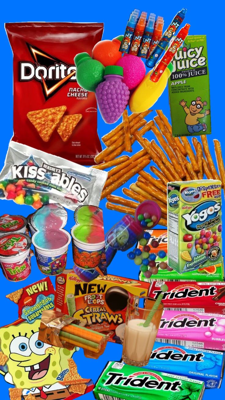 an assortment of snacks and candy on a blue background